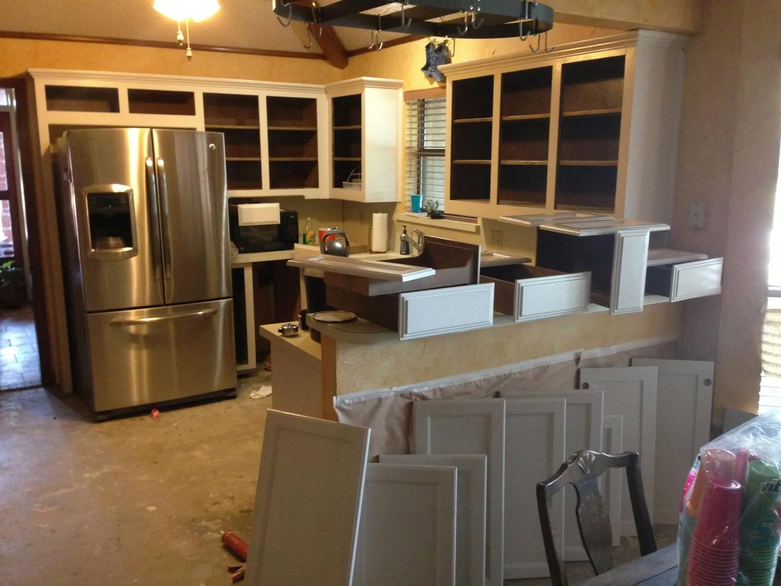 Kitchen stripped to the studs with cabinets removed